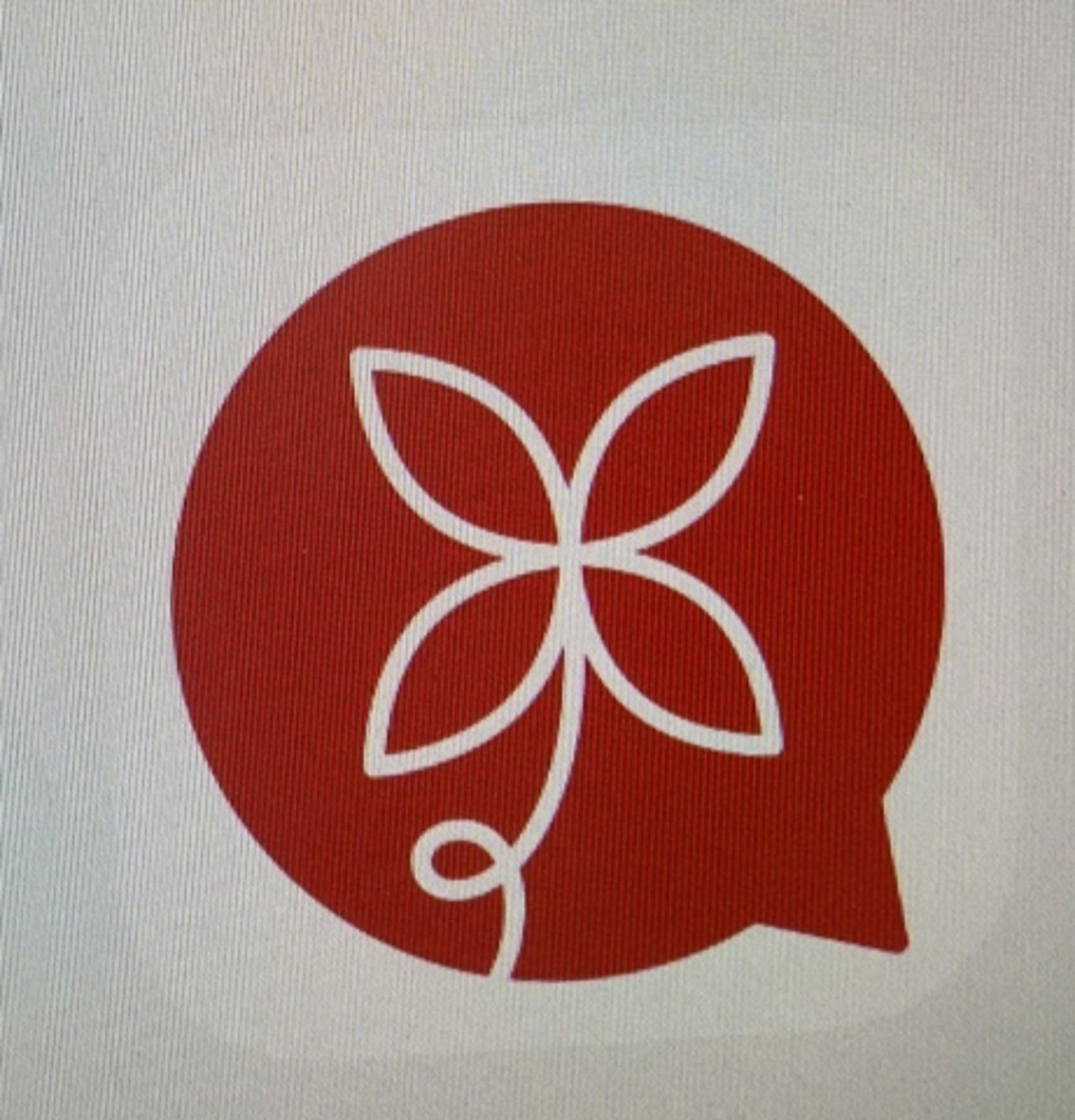 en rød sirkel med et hvitt symbol